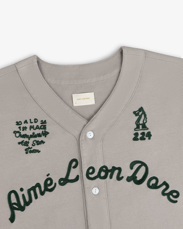 Mulberry Chainstitch Baseball Jersey in gray with dark green script and embroidered chest text and graphics.