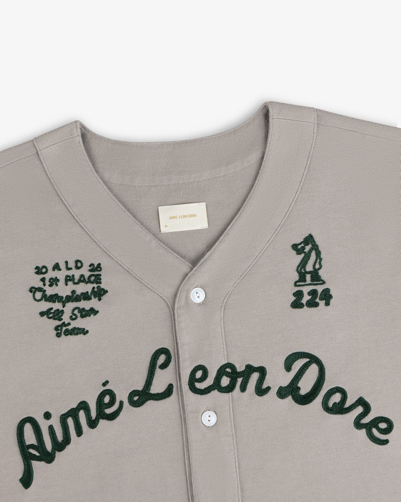 Mulberry Chainstitch Baseball Jersey in gray with dark green script and embroidered chest text and graphics.