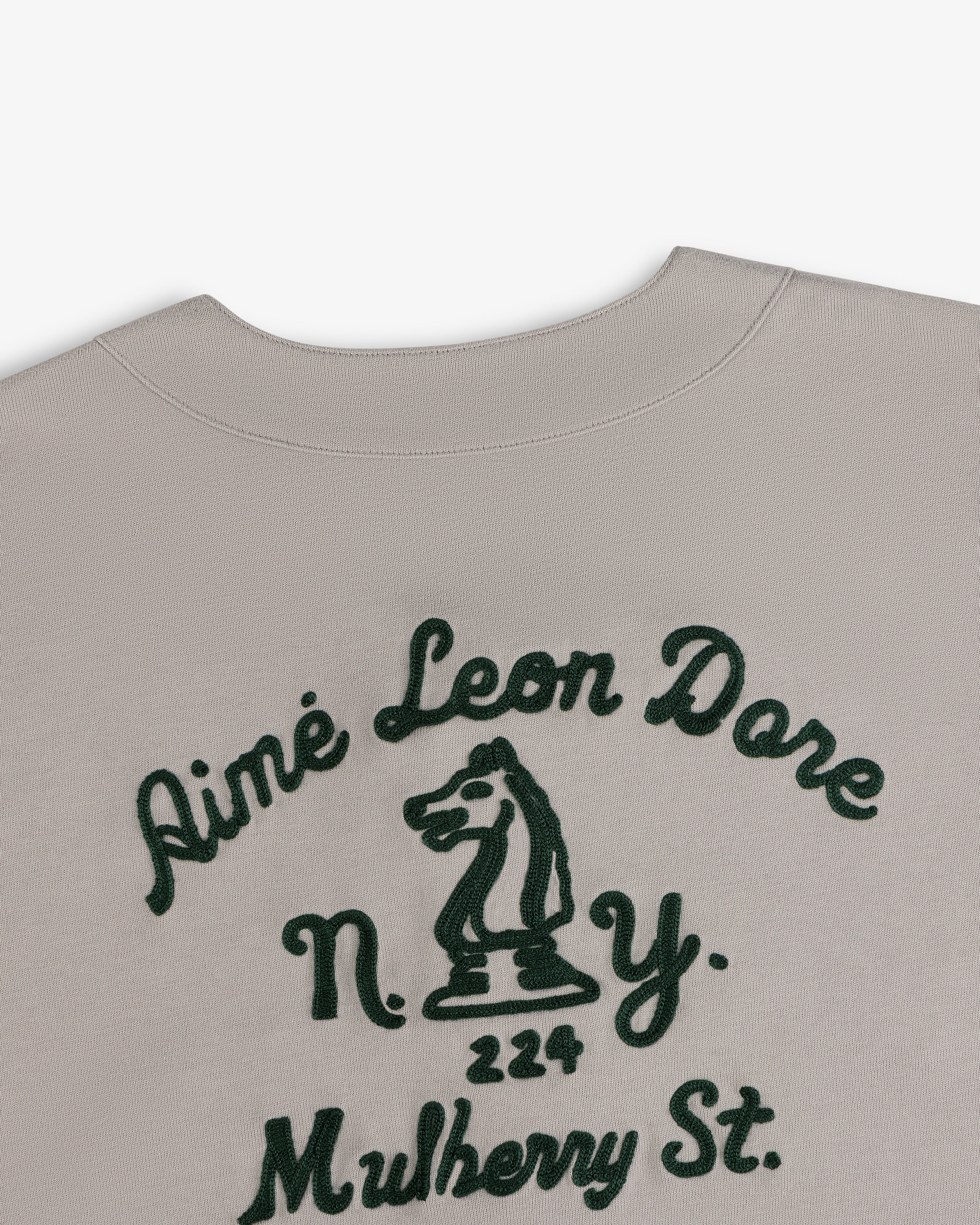 Beige Mulberry Chainstitch Baseball Jersey with green Aimé Leon Dore text, N.Y., 224 Mulberry, and chess knight.