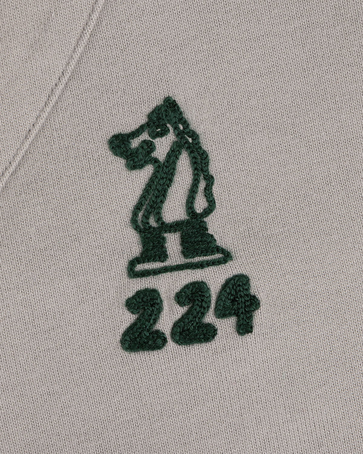 Mulberry Chainstitch Baseball Jersey with green chess knight and 224 embroidered on light fabric.