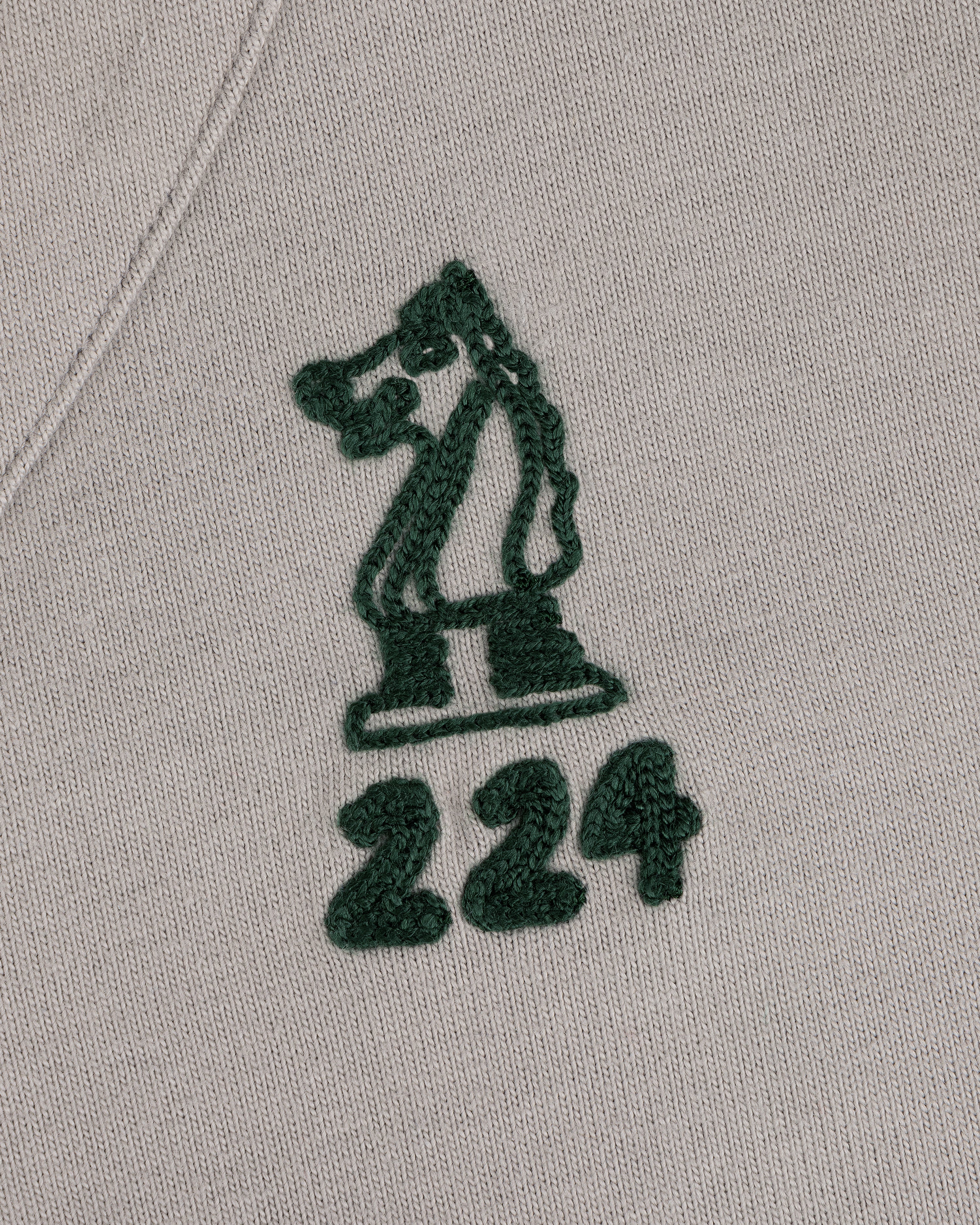 Mulberry Chainstitch Baseball Jersey with green chess knight and 224 embroidered on light fabric.
