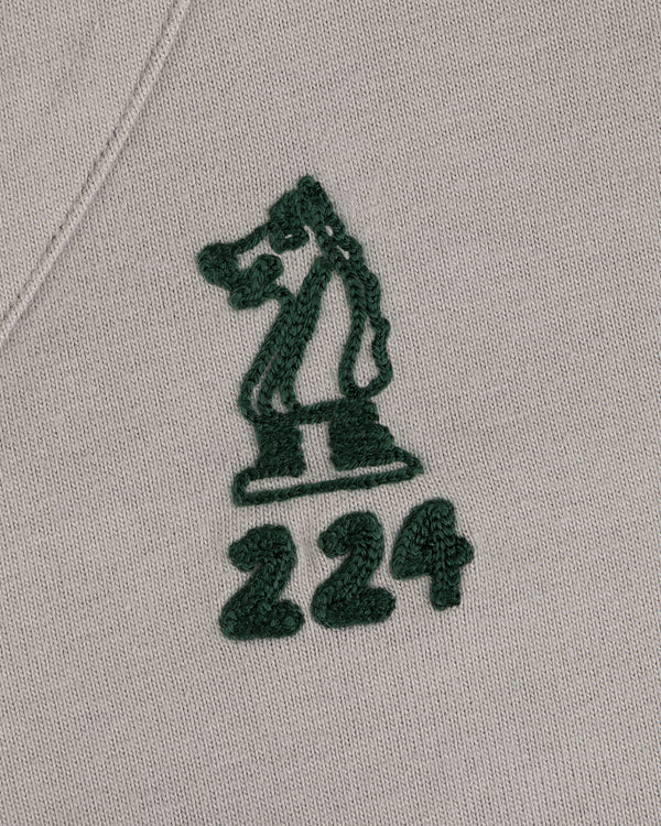 Mulberry Chainstitch Baseball Jersey with green chess knight and 224 embroidered on light fabric.