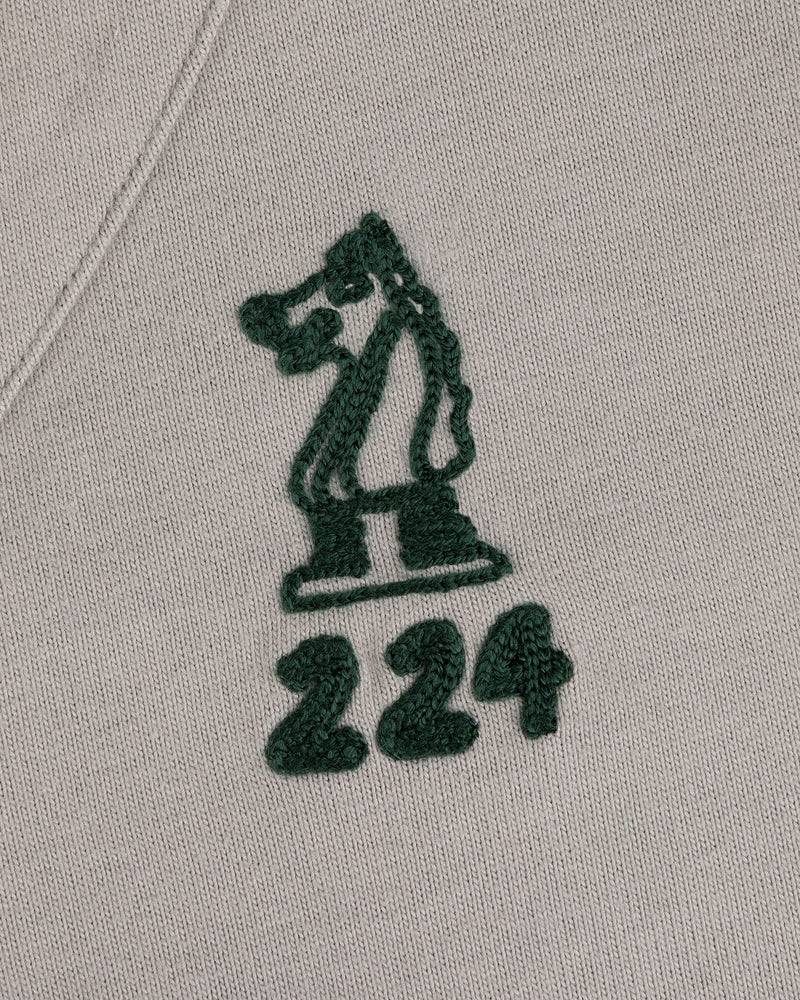 Mulberry Chainstitch Baseball Jersey with green chess knight and 224 embroidered on light fabric.