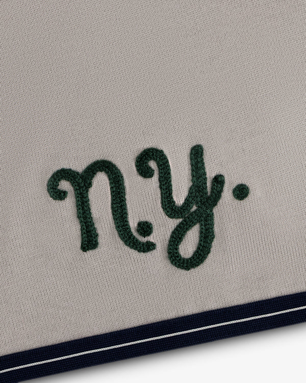 Mulberry Chainstitch Baseball Jersey: Embroidered green NY on beige with navy/white striped bottom edge.