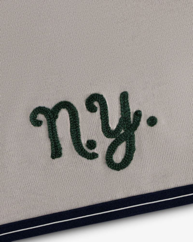 Mulberry Chainstitch Baseball Jersey: Embroidered green NY on beige with navy/white striped bottom edge.