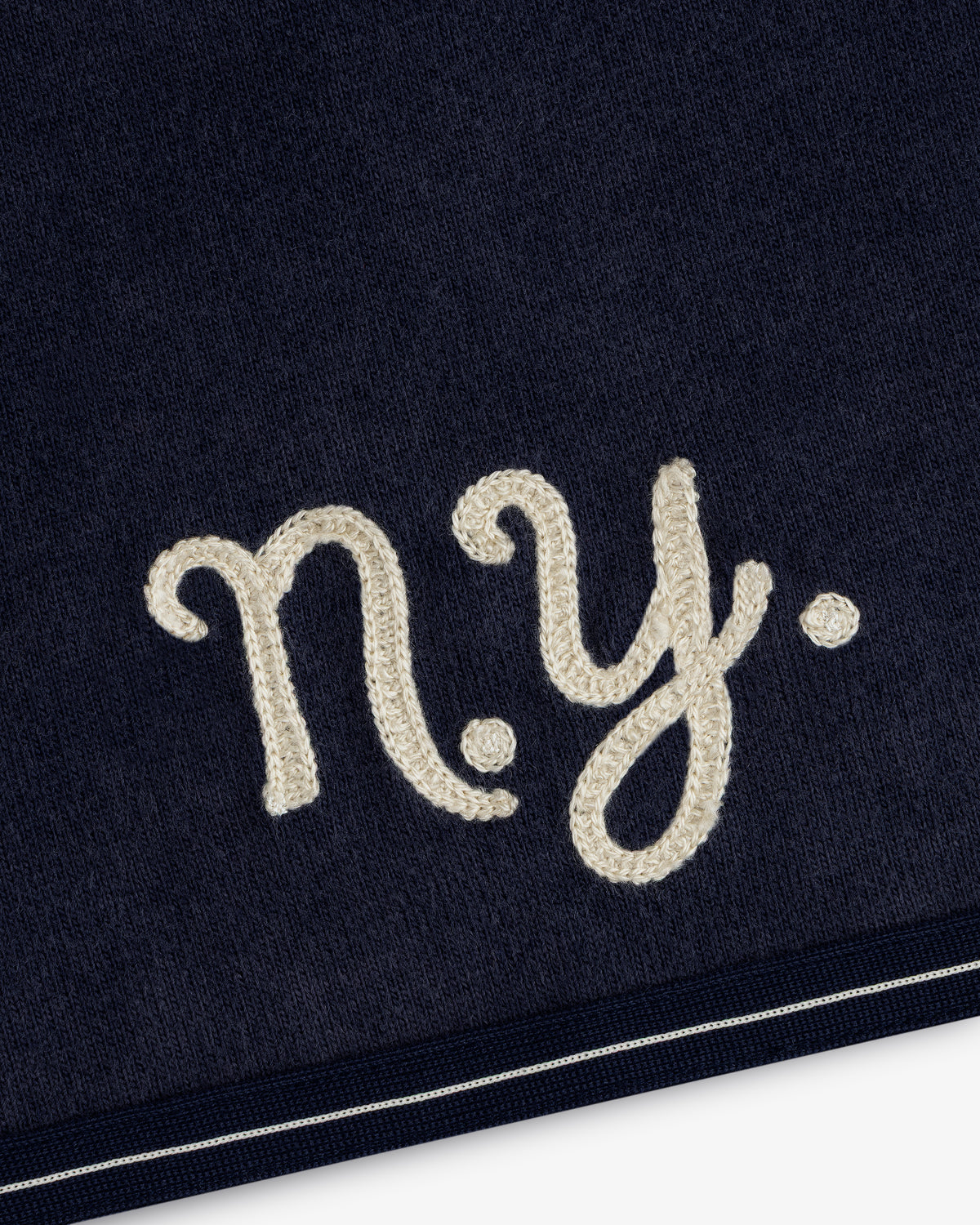 Navy Mulberry Chainstitch Baseball Jersey with “n.y.” white cursive near a white-striped edge.