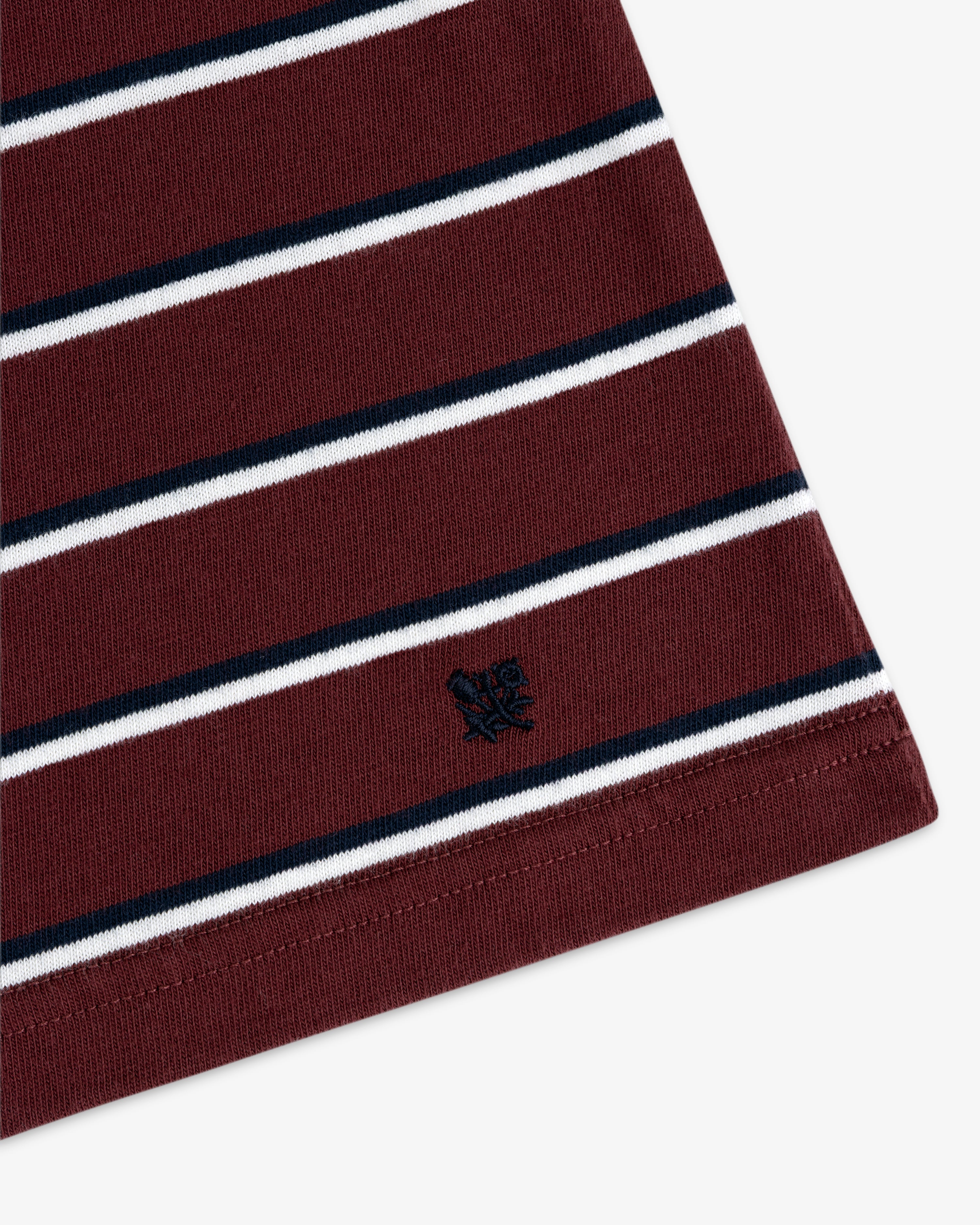 Yarn Dyed Striped Tee: Maroon with white/black stripes, small black logo embroidered near hem.