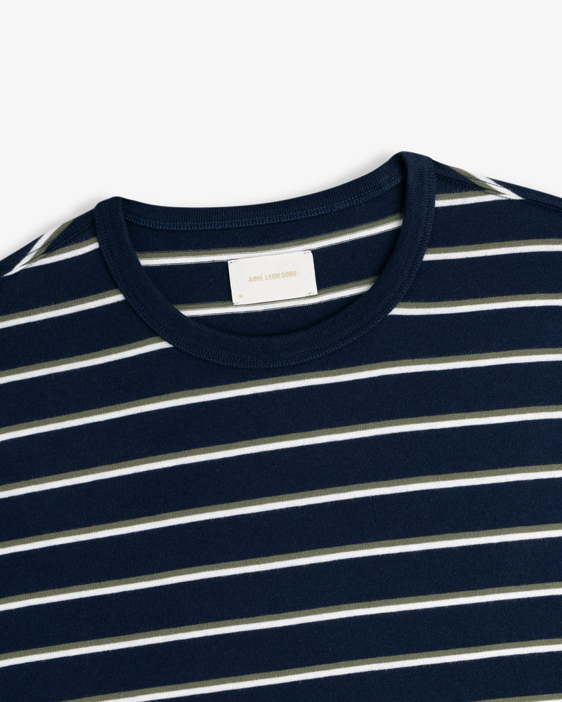 Yarn Dyed Striped Tee in navy with white and olive stripes, shown from the collar and upper chest.
