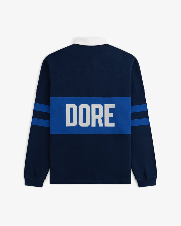 Leon Dore Collegiate Rugby: navy long-sleeve with blue stripes, “DORE” in white letters across the back.