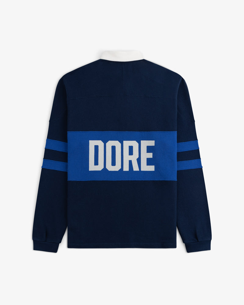 Leon Dore Collegiate Rugby: navy long-sleeve with blue stripes, “DORE” in white letters across the back.