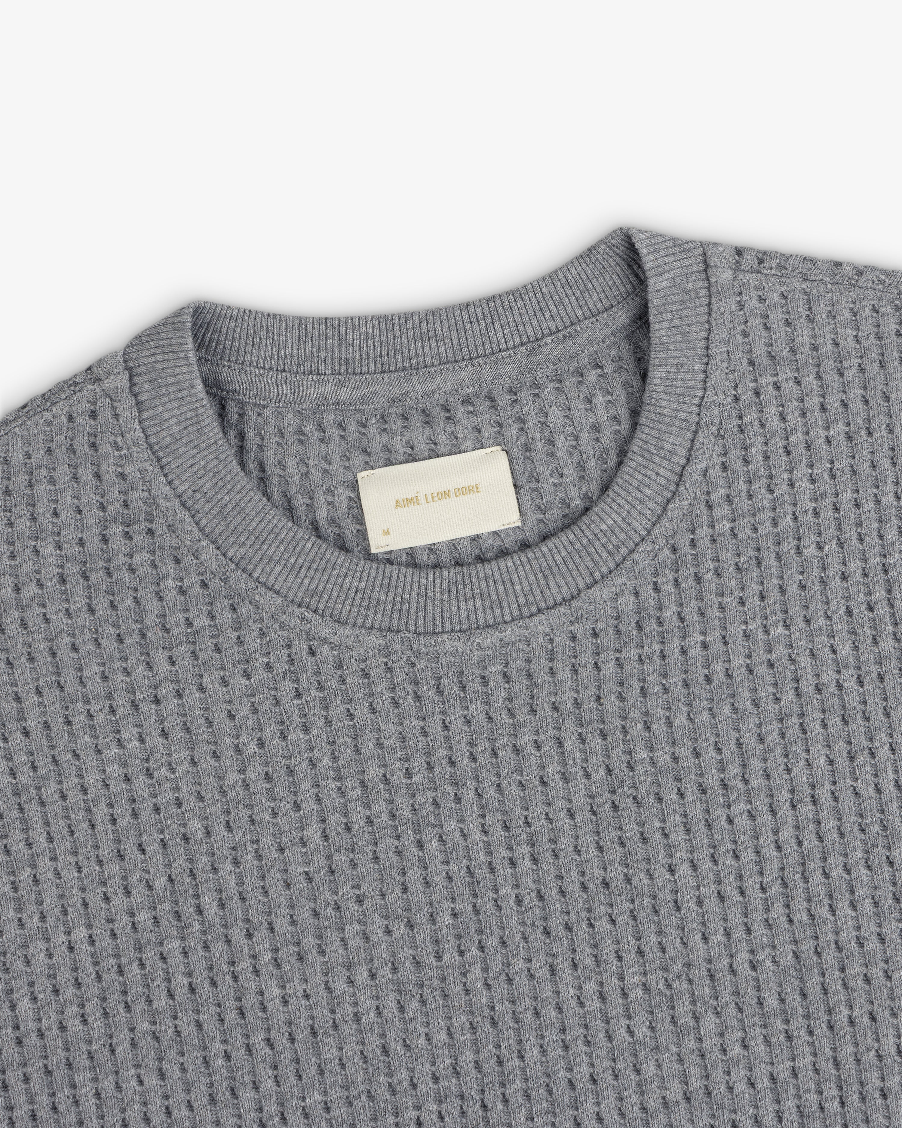Grey Long-Sleeve Waffle Thermal shirt with a ribbed crew neck and inner brand label.