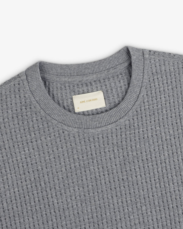 Grey Long-Sleeve Waffle Thermal shirt with a ribbed crew neck and inner brand label.