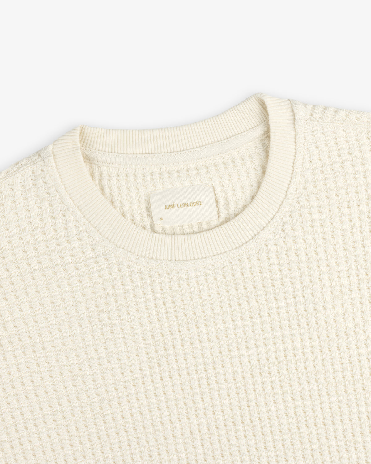 Off-white Long-Sleeve Waffle Thermal shirt with a waffle-knit texture.