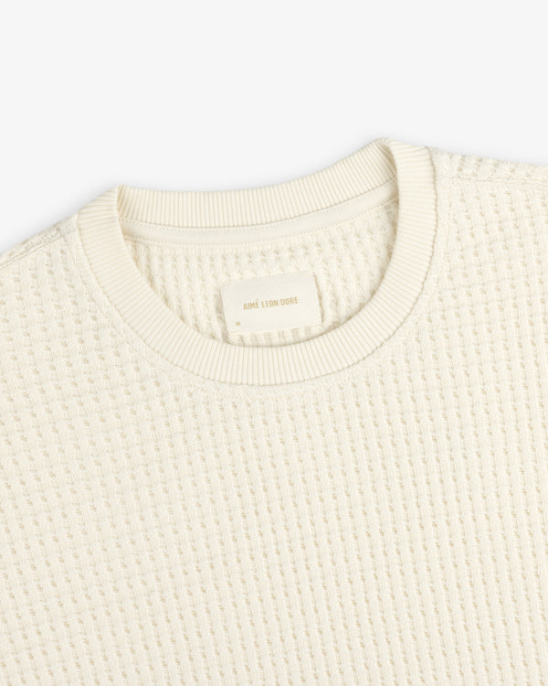 Off-white Long-Sleeve Waffle Thermal shirt with a waffle-knit texture.
