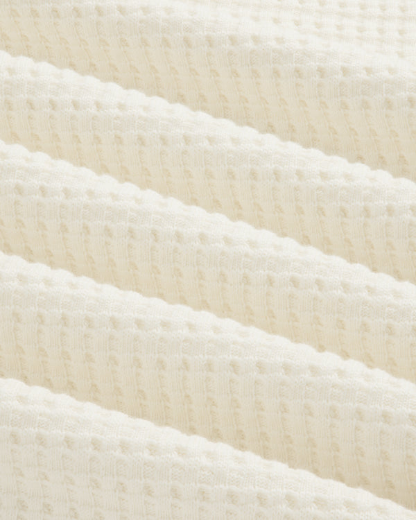 Off-white Long-Sleeve Waffle Thermal fabric with a textured waffle-knit pattern in diagonal folds.