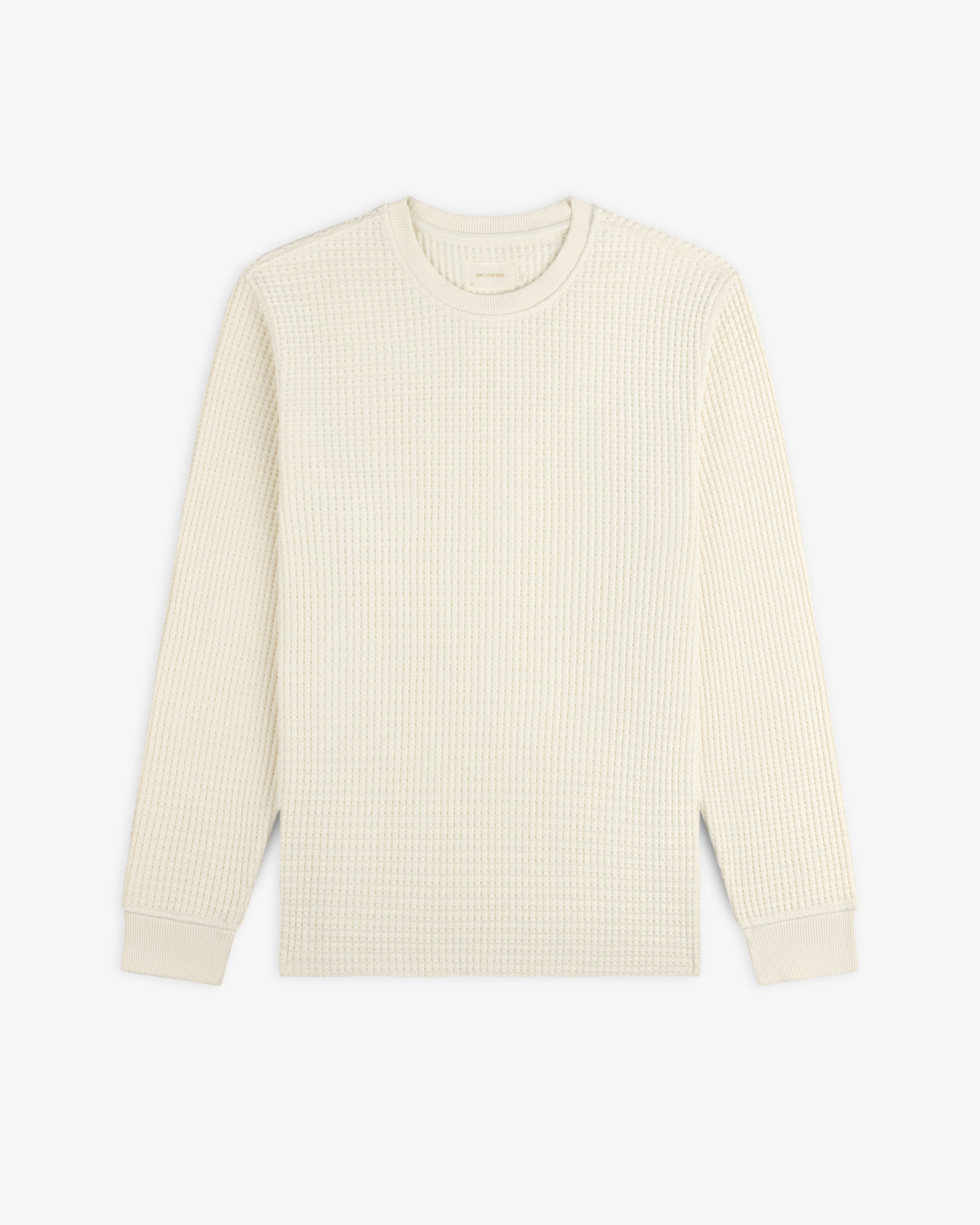 Off-white Long-Sleeve Waffle Thermal crewneck shirt with a textured waffle-knit pattern.