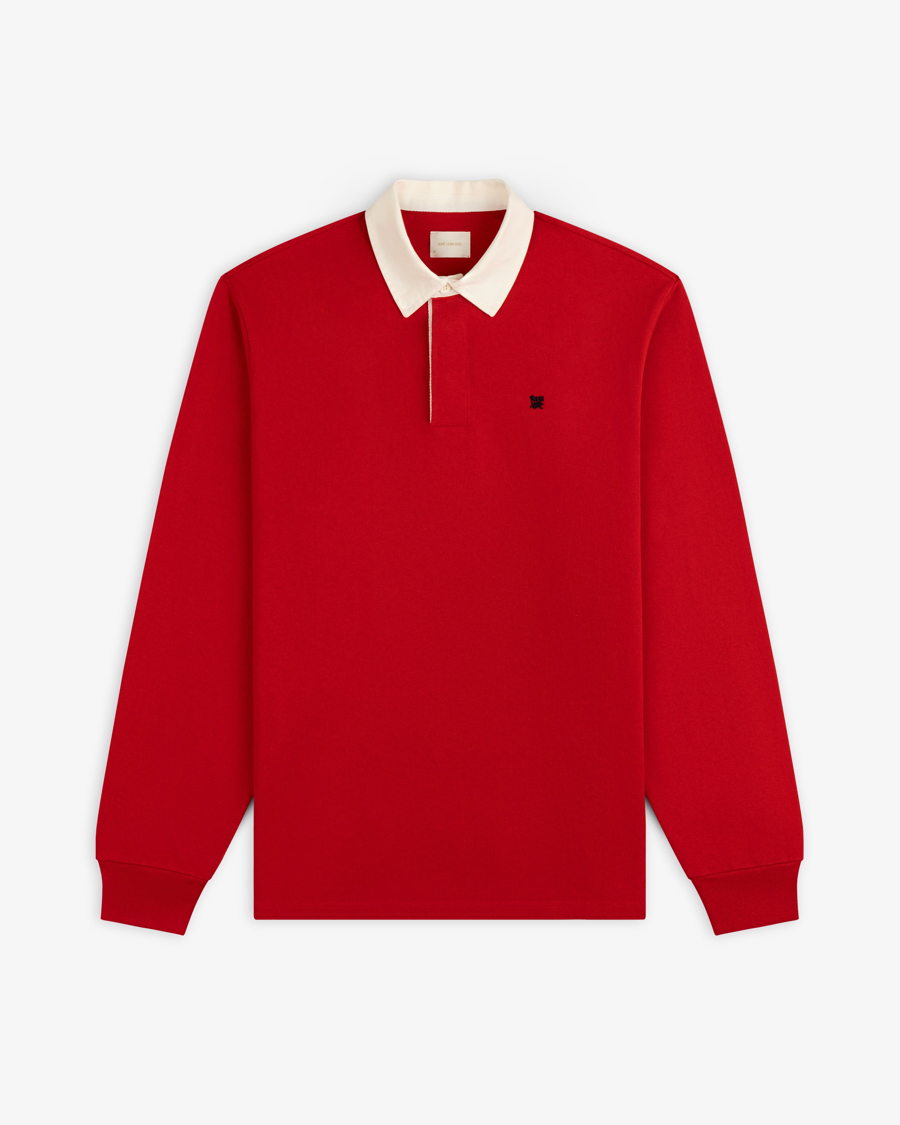 Crest Rugby red long-sleeve polo with white collar and black chest logo, shown flat on a white background.