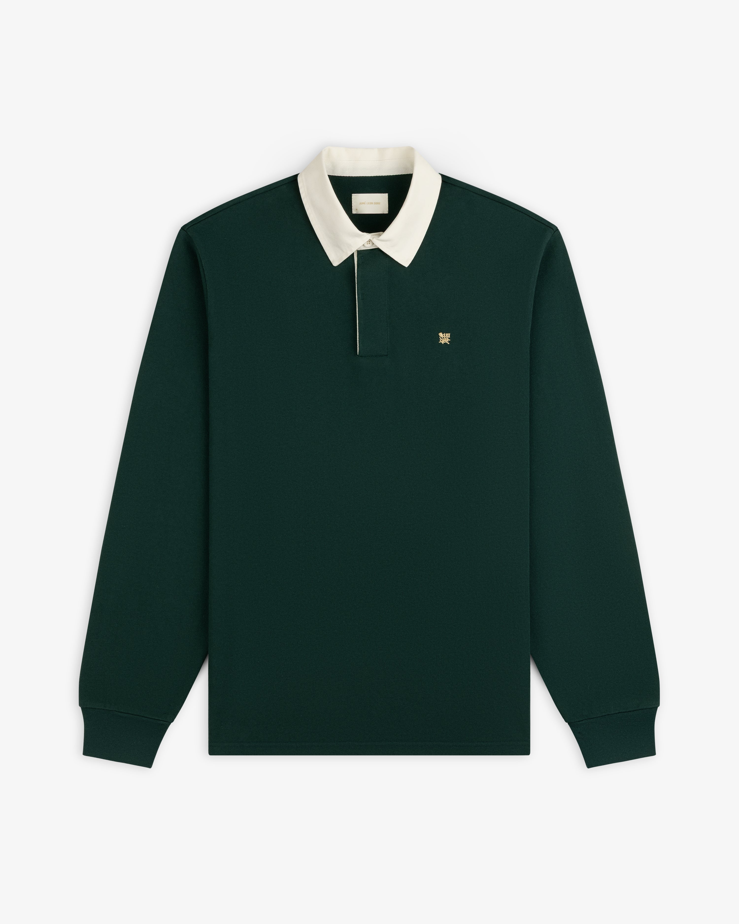 Crest Rugby: Dark green long-sleeve polo with white collar, embroidered chest logo, on white background.