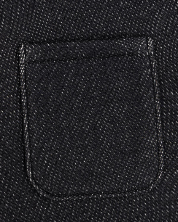 Close-up of a dark, textured Terry Lounge Shirt with a rectangular chest pocket.