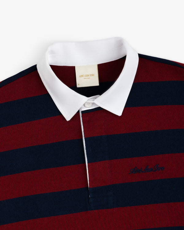 Striped Script Rugby shirt in maroon and navy blue stripes with a white collar and an embroidered chest logo.