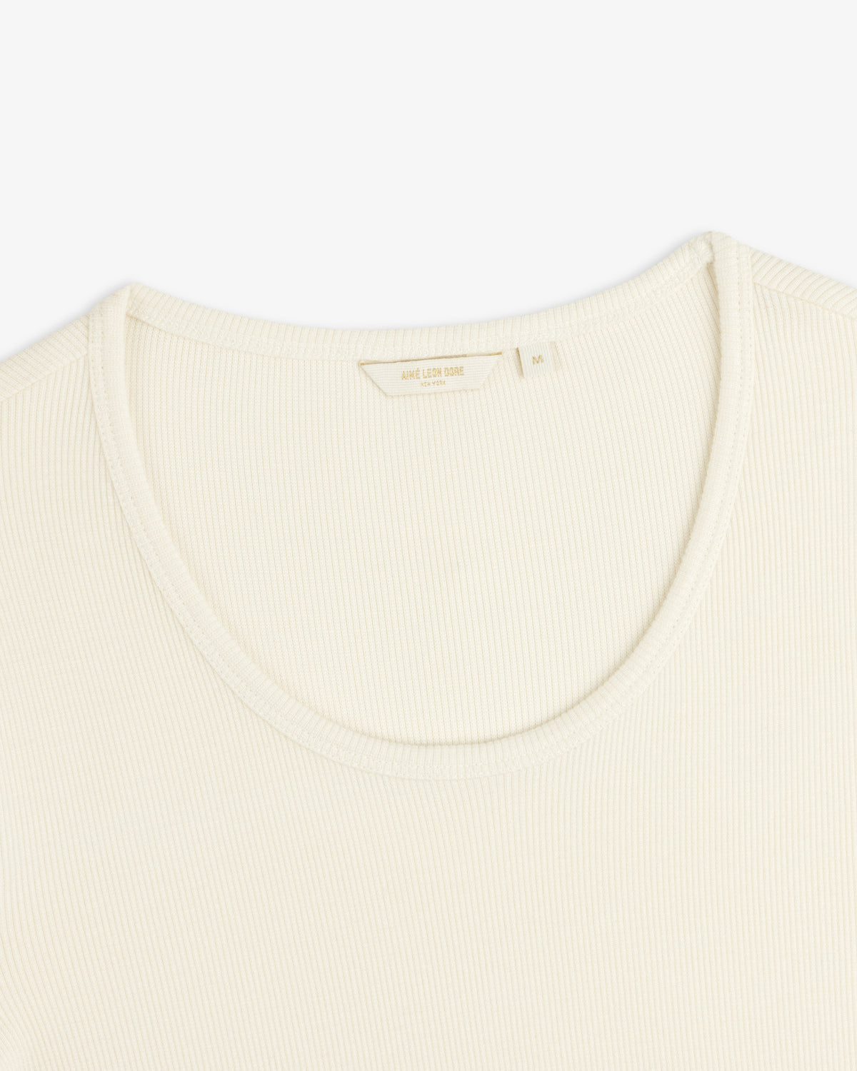 Cream-colored Ribbed Scoop Neck Long-Sleeve Tee with a scoop neckline and a size M interior tag.