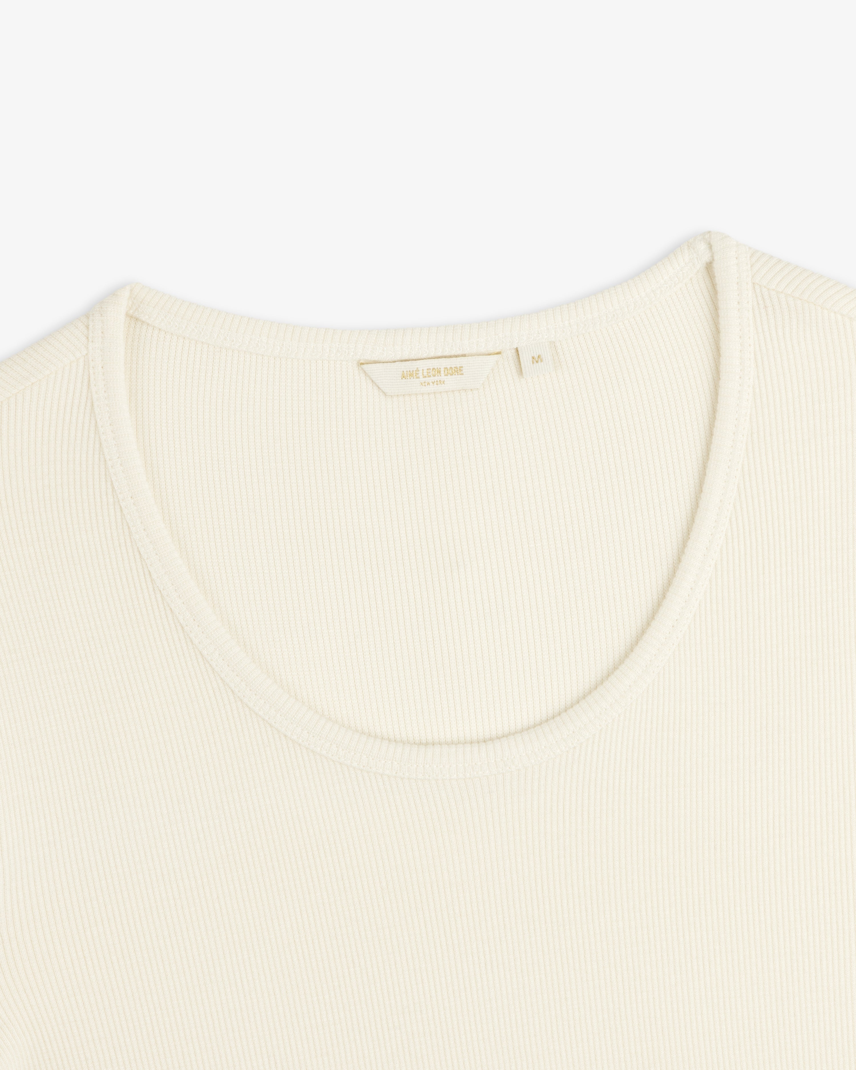 Cream-colored Ribbed Scoop Neck Long-Sleeve Tee with a scoop neckline and a size M interior tag.