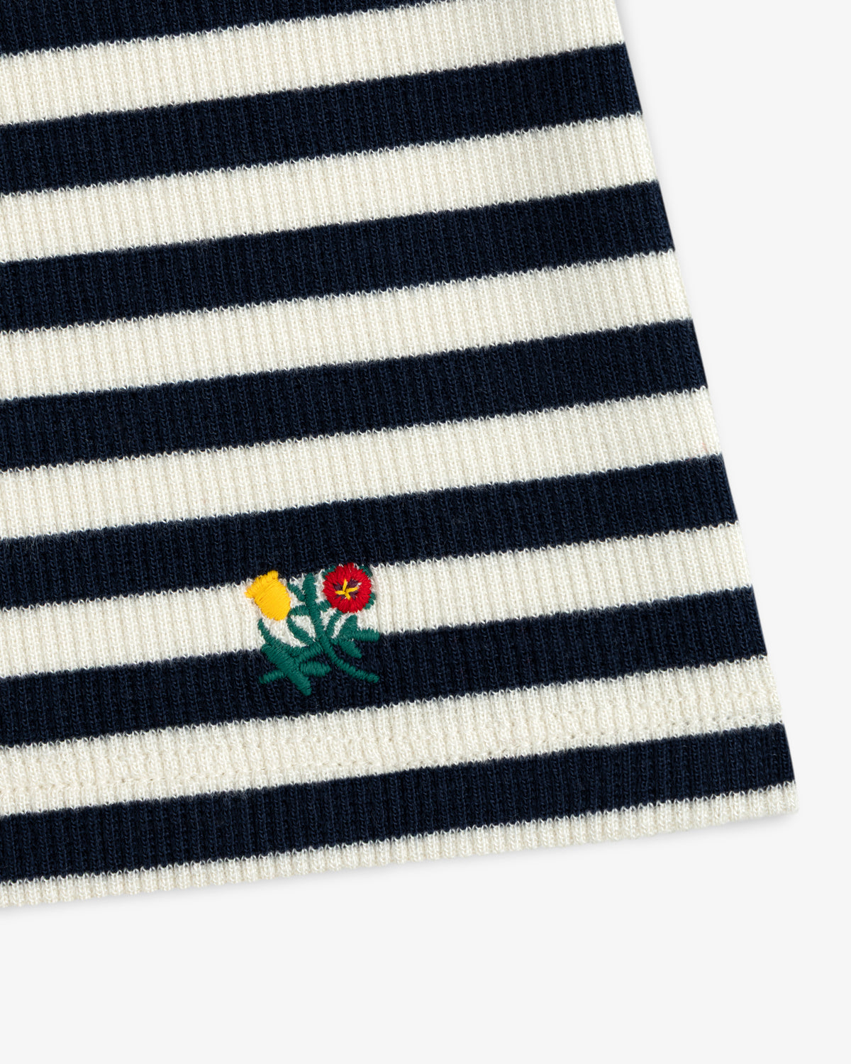 Ribbed Scoop Neck Long-Sleeve Tee in navy and white striped ribbed knit fabric with a small embroidered flower motif.