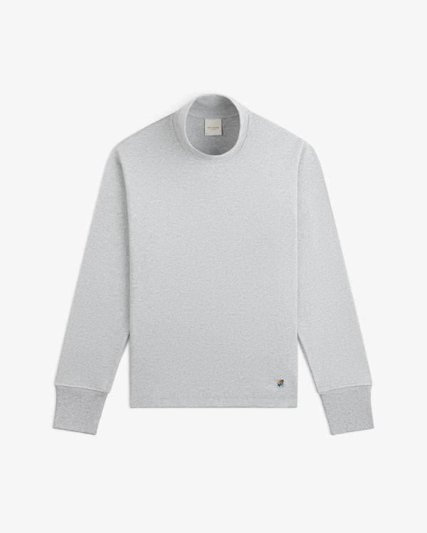 Light gray Heavyweight Crest Mockneck Tee with a small embroidered emblem near the hem.