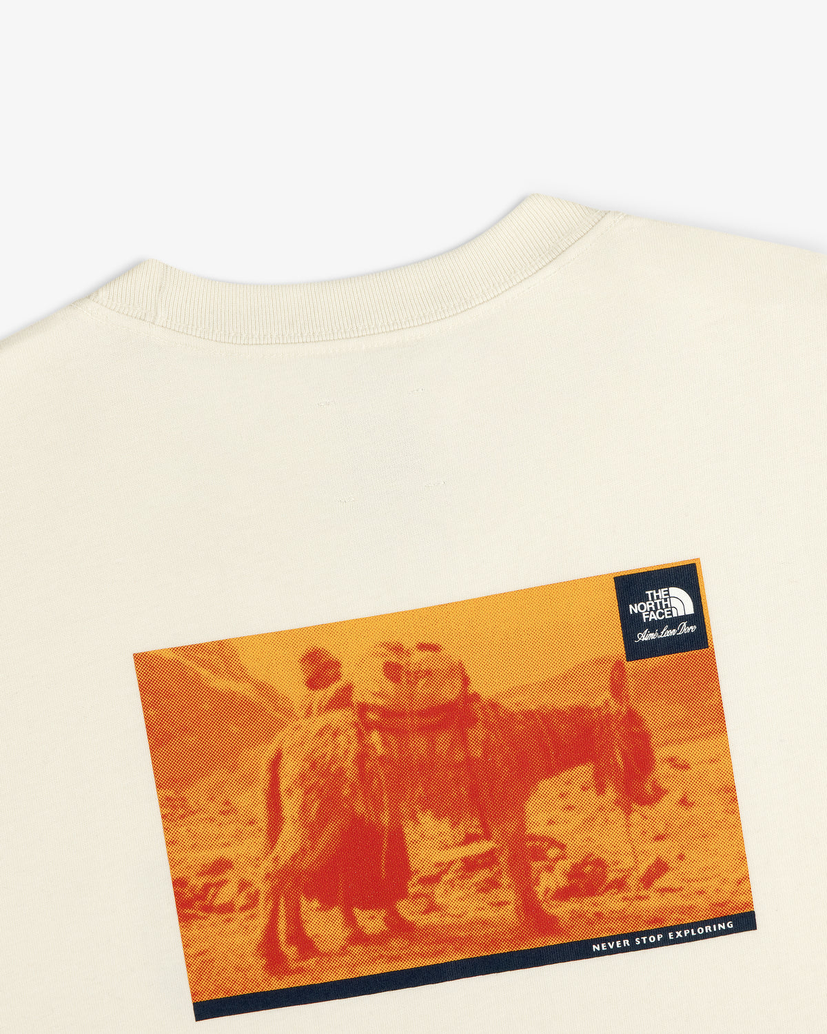 ALD/The North Face Long-Sleeve Explorer Tee in cream with donkey graphic, logo, and Never Stop Exploring text.