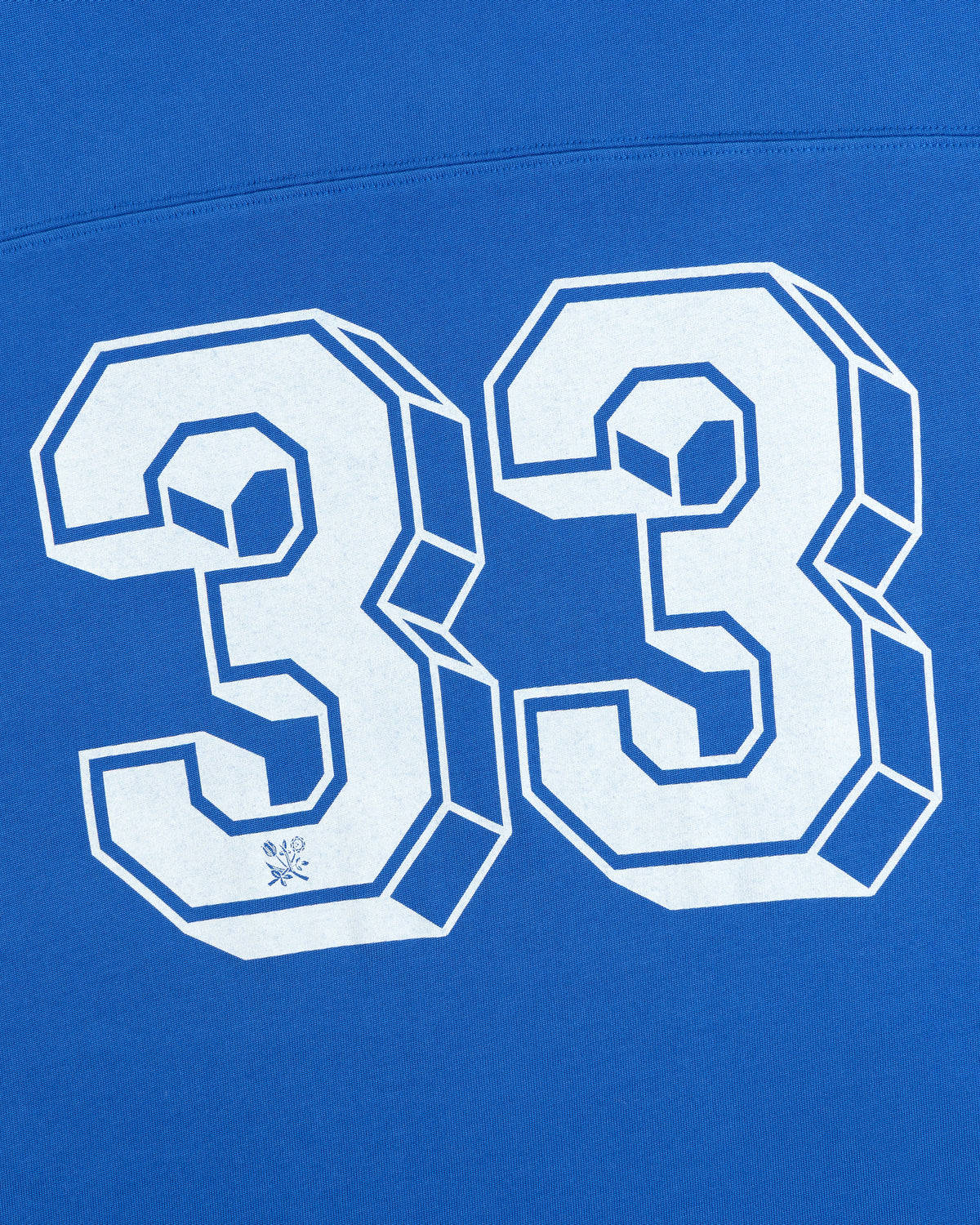White 3D block lettering of the number 33 on a bright blue Football Ringer Tee.