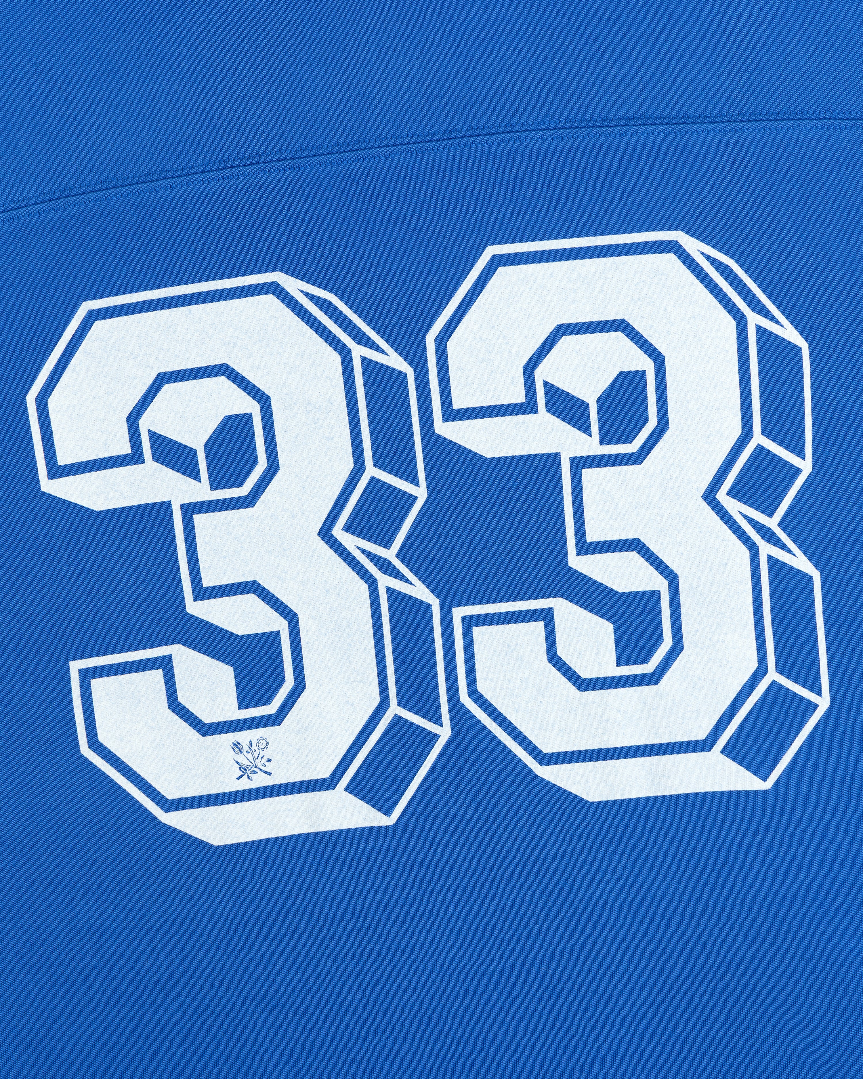 White 3D block lettering of the number 33 on a bright blue Football Ringer Tee.