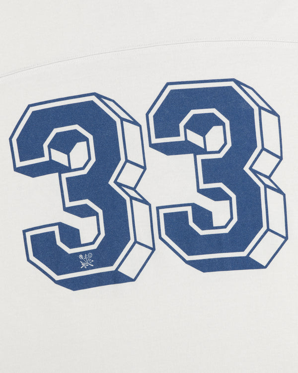 Blue block-style number 33 printed on a white Football Ringer Tee.