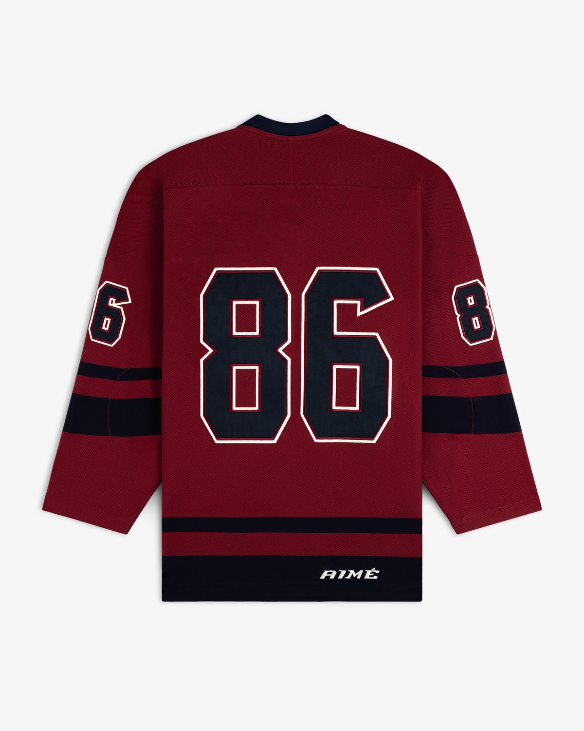 Back of a maroon Team Aimé Hockey Jersey with navy and white number 86 on the sleeves and back, and Aimé on the hem.