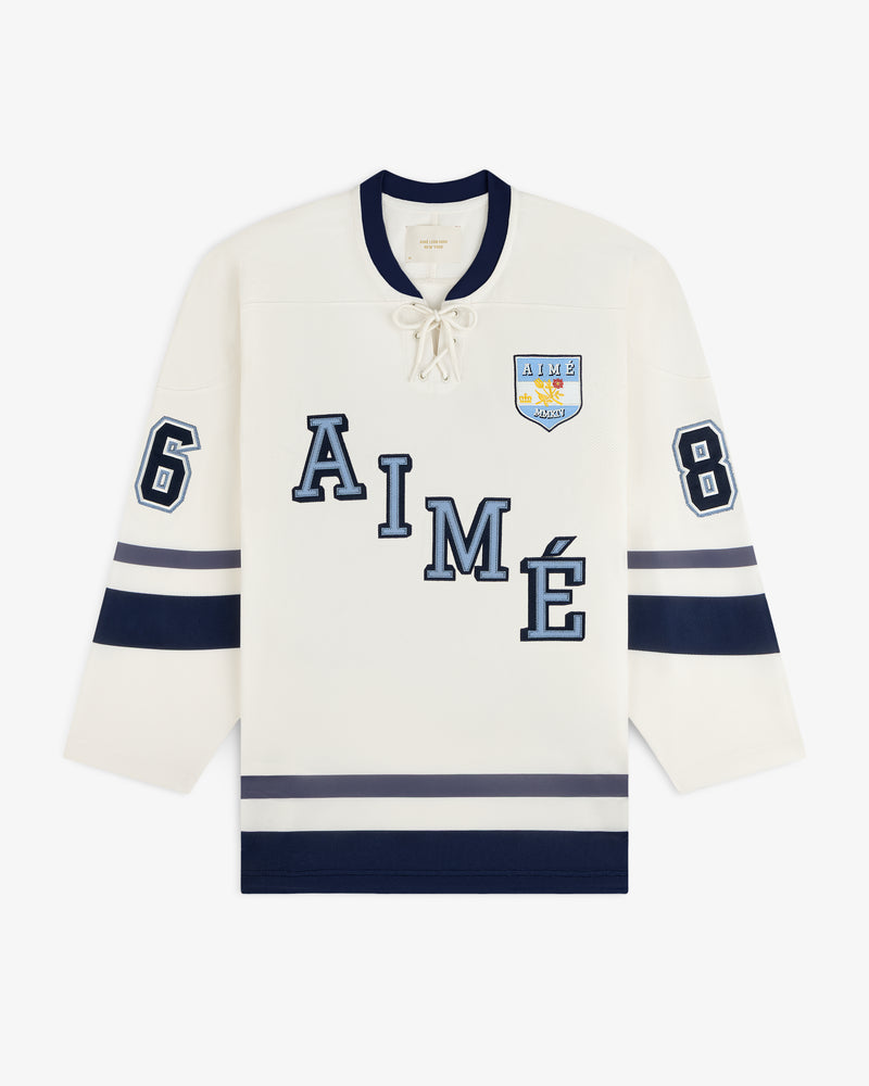 Cream-colored Team Aimé Hockey Jersey with a lace-up neck, AIME across the chest, and the number 68 on the sleeves.