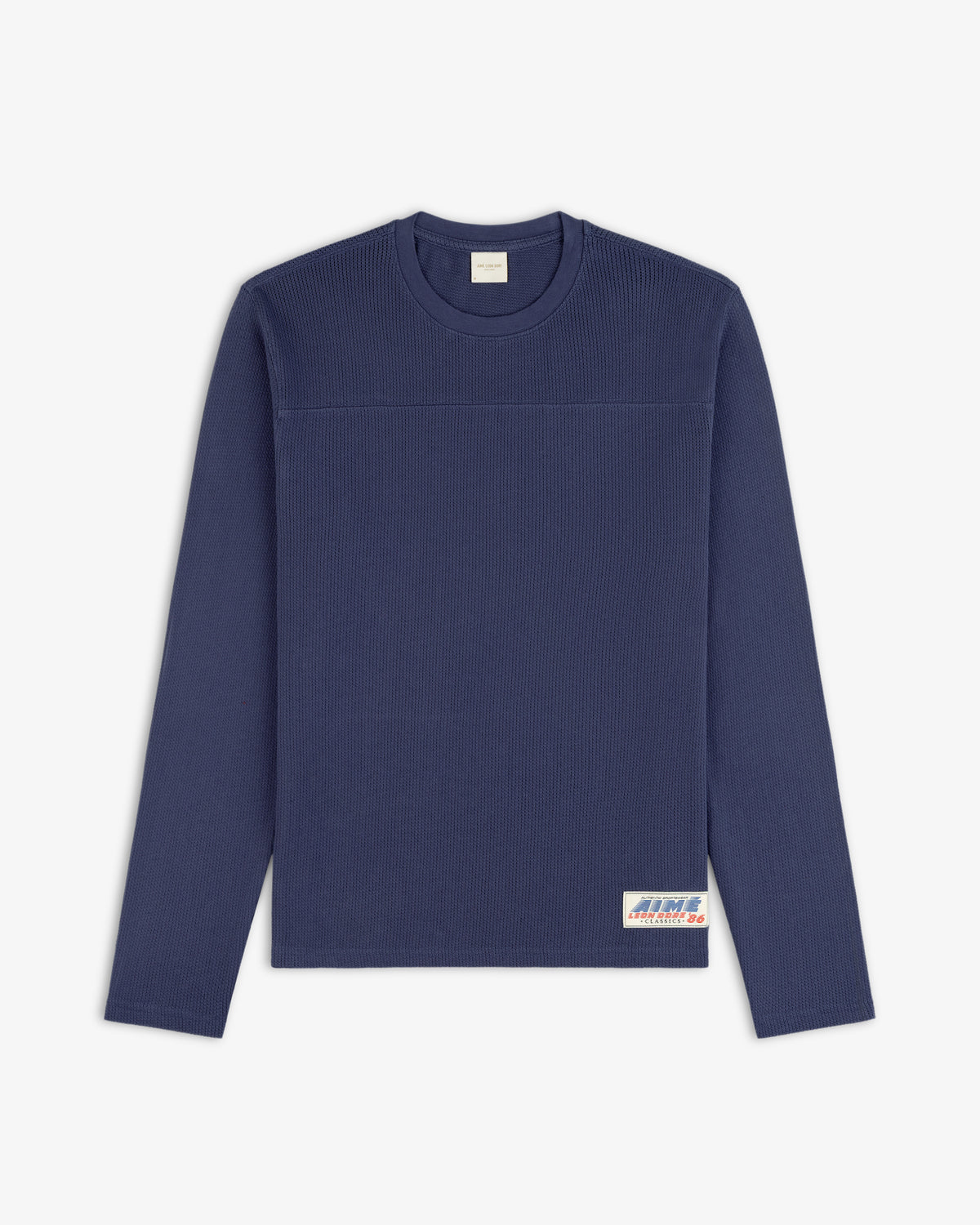 Navy blue Long-Sleeve Mesh Football Tee with ribbed texture and a small white label near the bottom hem.