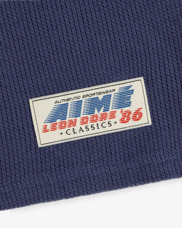 Blue mesh Long-Sleeve Football Tee with a rectangular “Authentic Sportswear Lion Boss 86 Classics” patch.