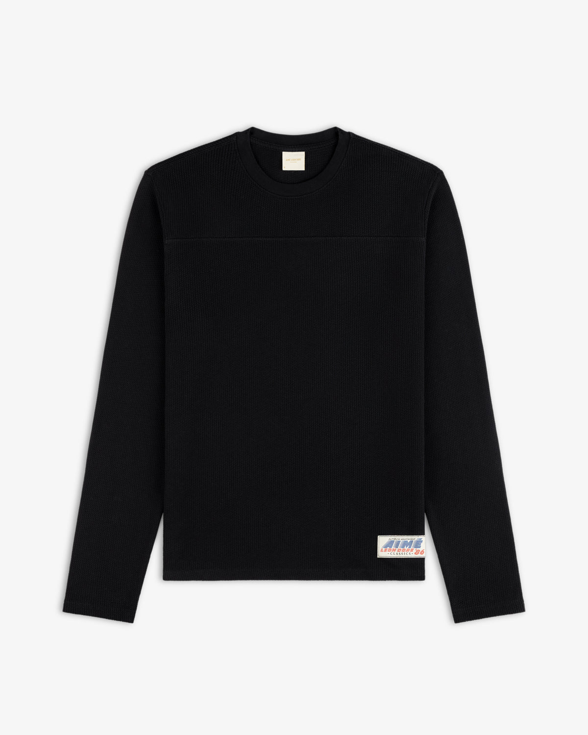 Long-Sleeve Mesh Football Tee in black with a small bottom-right patch, shown on a white background.