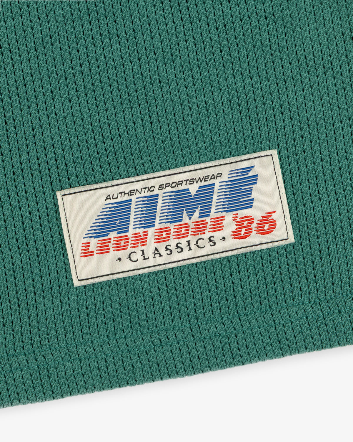Green Long-Sleeve Mesh Football Tee with white label reading AUTHENTIC SPORTSWEAR LION BROS 86 CLASSICS.