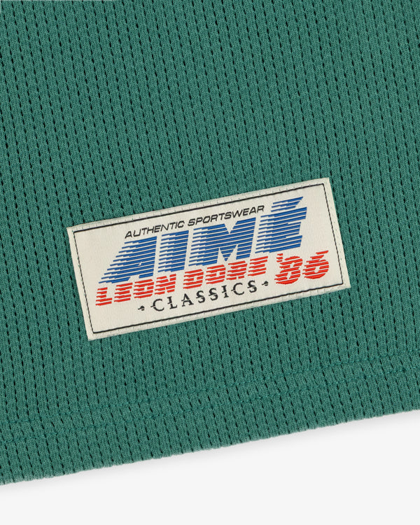 Green Long-Sleeve Mesh Football Tee with white label reading AUTHENTIC SPORTSWEAR LION BROS 86 CLASSICS.