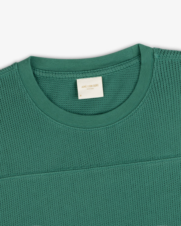 Green Long-Sleeve Mesh Football Tee with visible inner collar label, displayed flat on a white background.