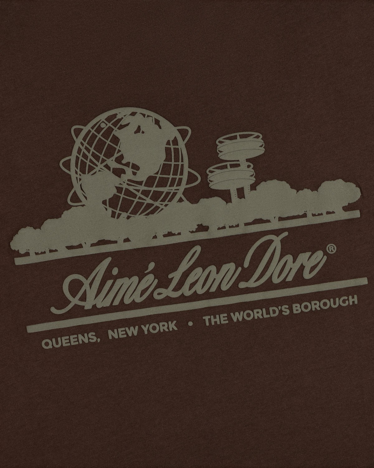 Unisphere Tee featuring a graphic of the Unisphere, trees, and “Aimé Leon Dore. Queens, New York. The Worlds Borough.”.