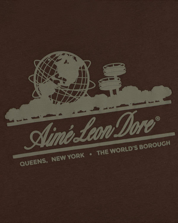 Unisphere Tee featuring a graphic of the Unisphere, trees, and “Aimé Leon Dore. Queens, New York. The Worlds Borough.”.