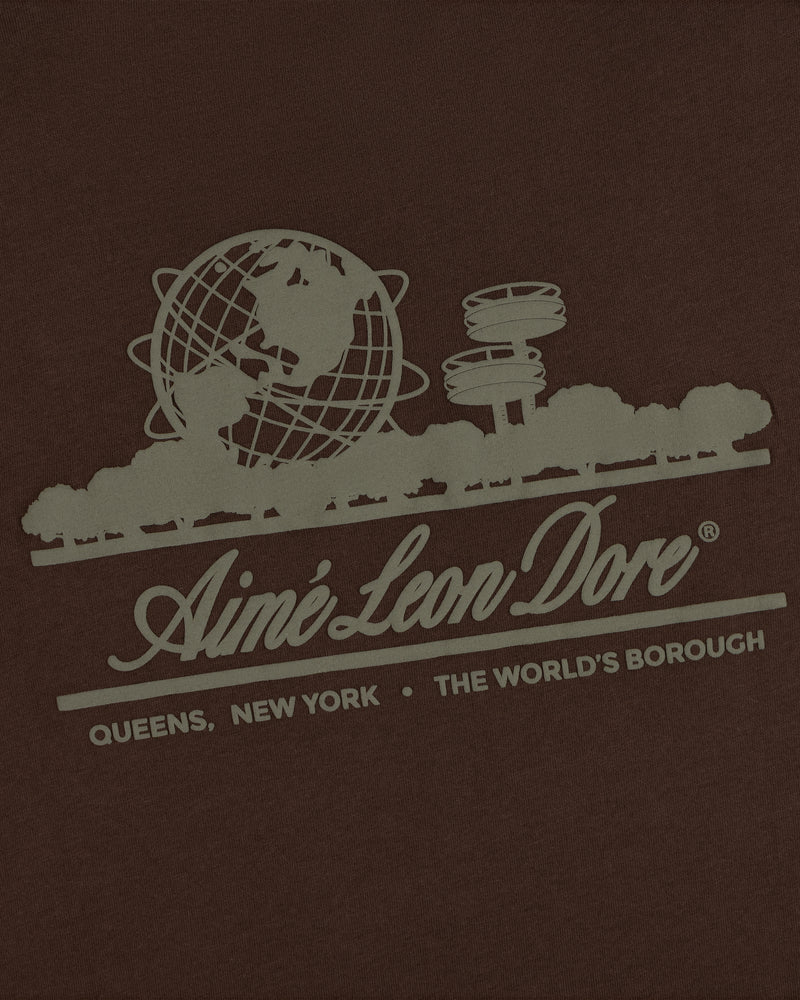 Unisphere Tee featuring a graphic of the Unisphere, trees, and “Aimé Leon Dore. Queens, New York. The Worlds Borough.”.