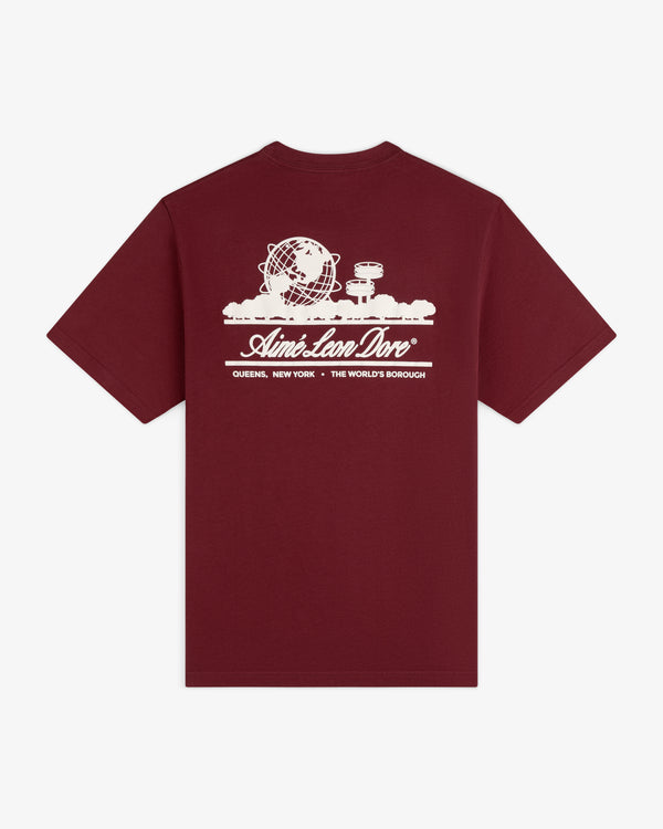 Unisphere Tee: Maroon shirt featuring a white graphic of the Unisphere, street signs, and Aimé Leon Dore on the back.