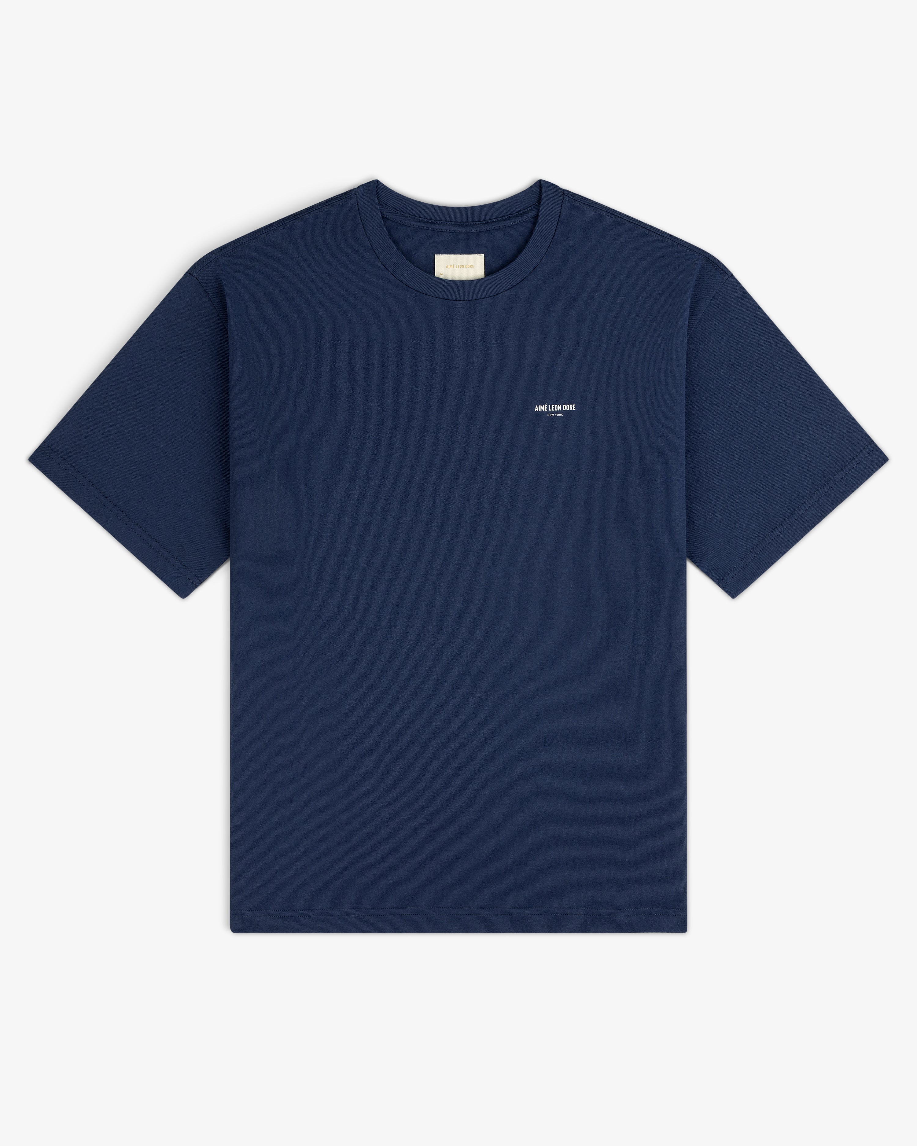 Micro Logo Tee in navy, short sleeves, small white chest text, displayed flat on a white background.