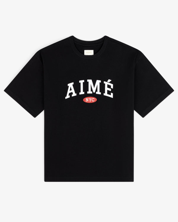 Aimé Souvenir Tee: Black shirt with bold white AIMÉ and small red NYC oval below the text.