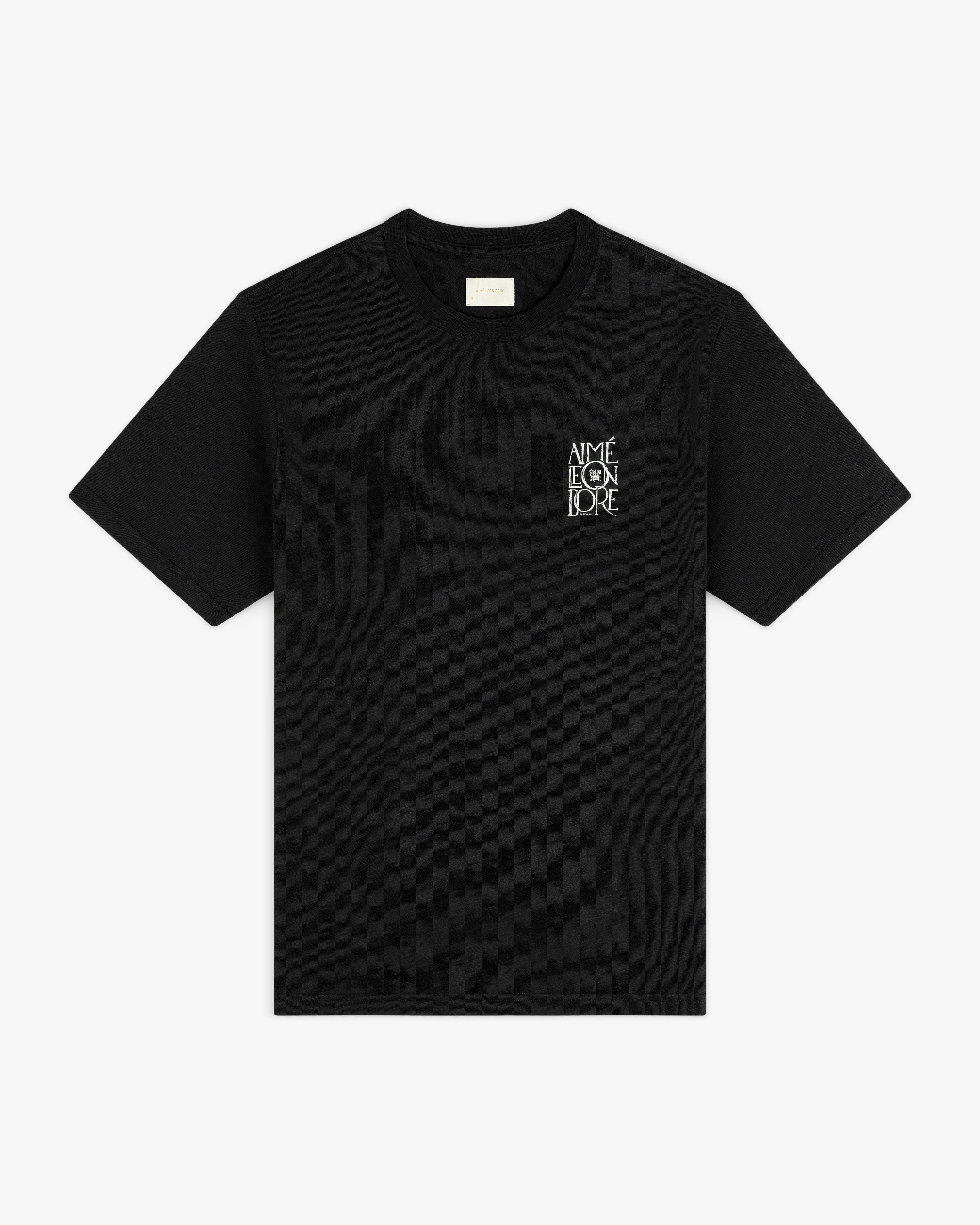 Black short-sleeve Stacked Logo Slub Tee with small white AIME LEON DORE text on upper left chest.