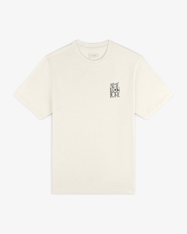 Off-white Stacked Logo Slub Tee with black AIMÉ LEON DORE text on the left chest.