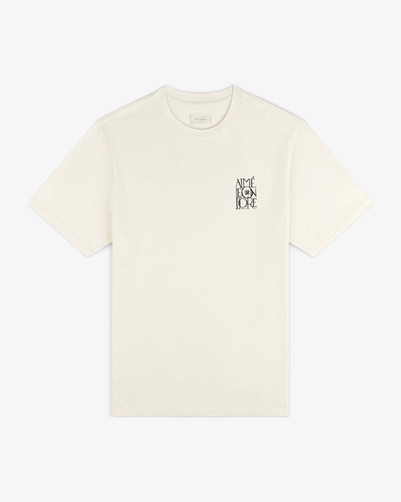 Off-white Stacked Logo Slub Tee with black AIMÉ LEON DORE text on the left chest.