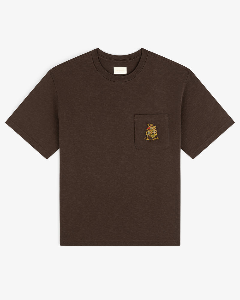 Saint George Slub Pocket Tee—brown, short sleeves, animal crest on chest pocket, shown on white background.